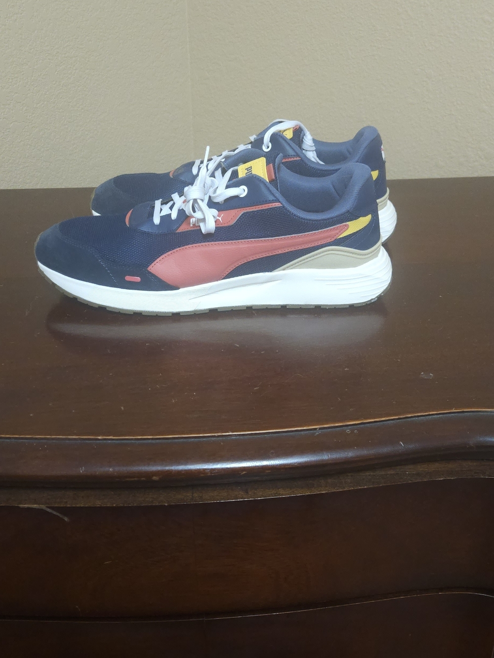 Puma Navy Sneakers with Red and Yellow Accents